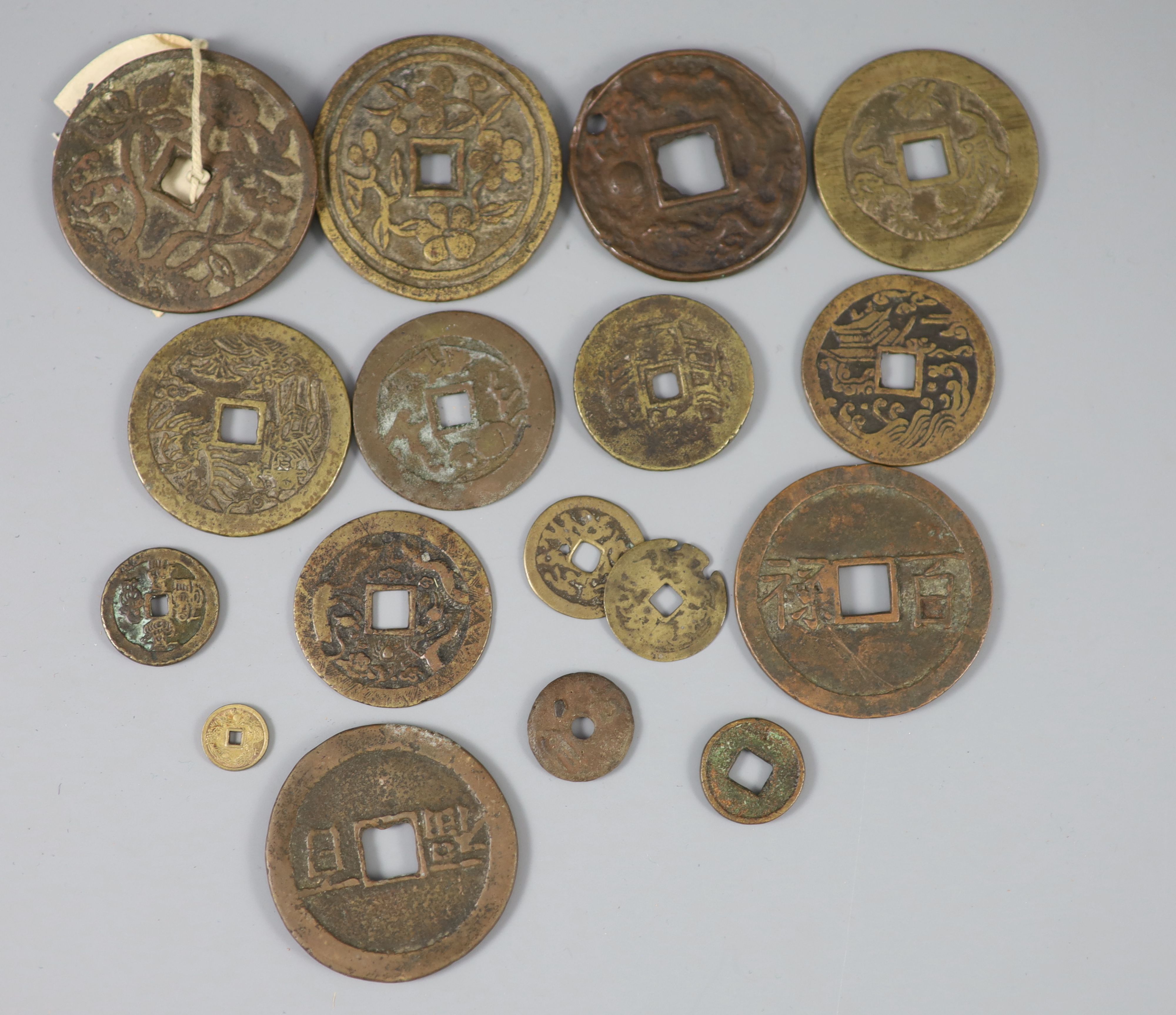 China, 17 bronze or copper charms or amulets, Qing dynasty,